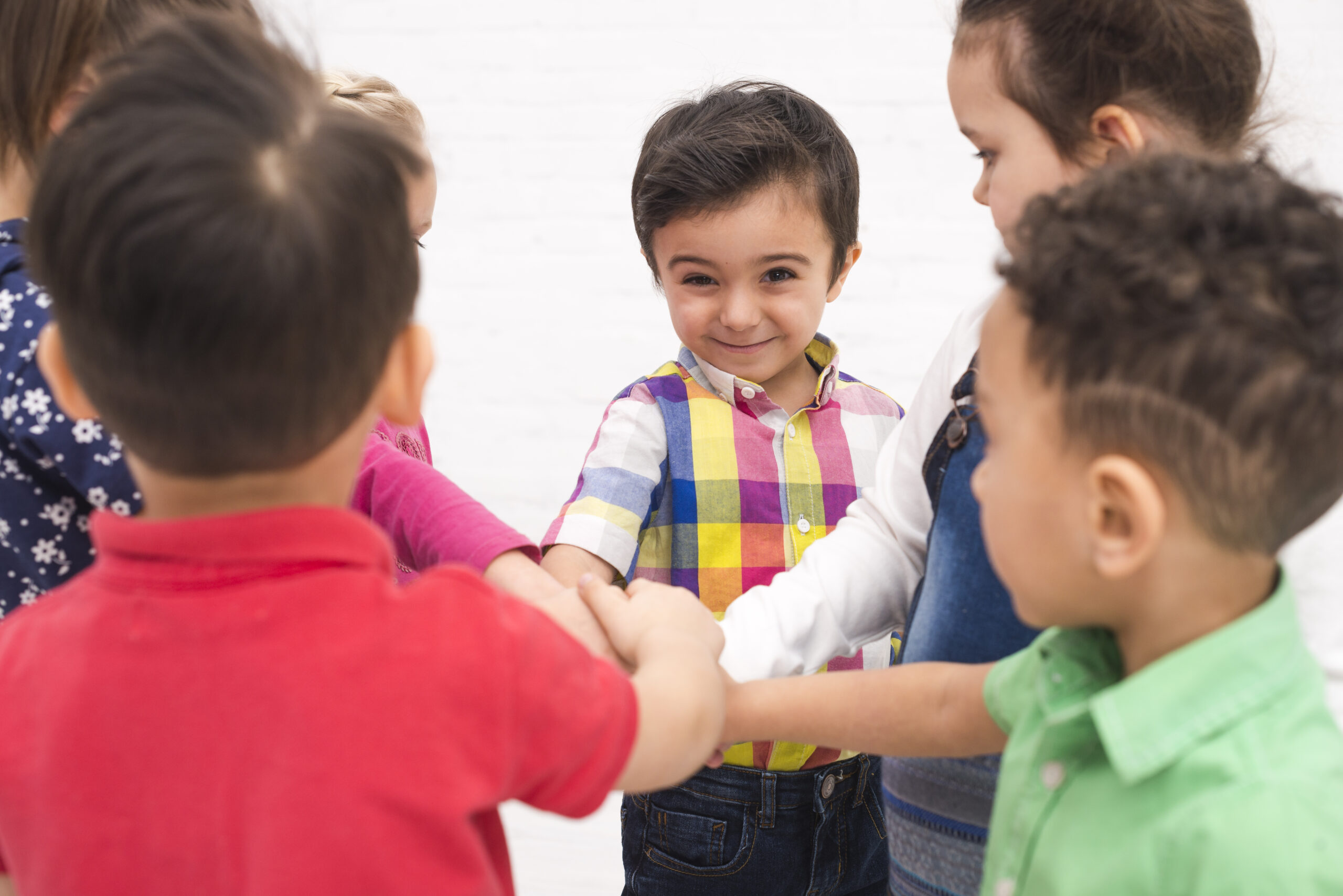 Children holding hands in a group